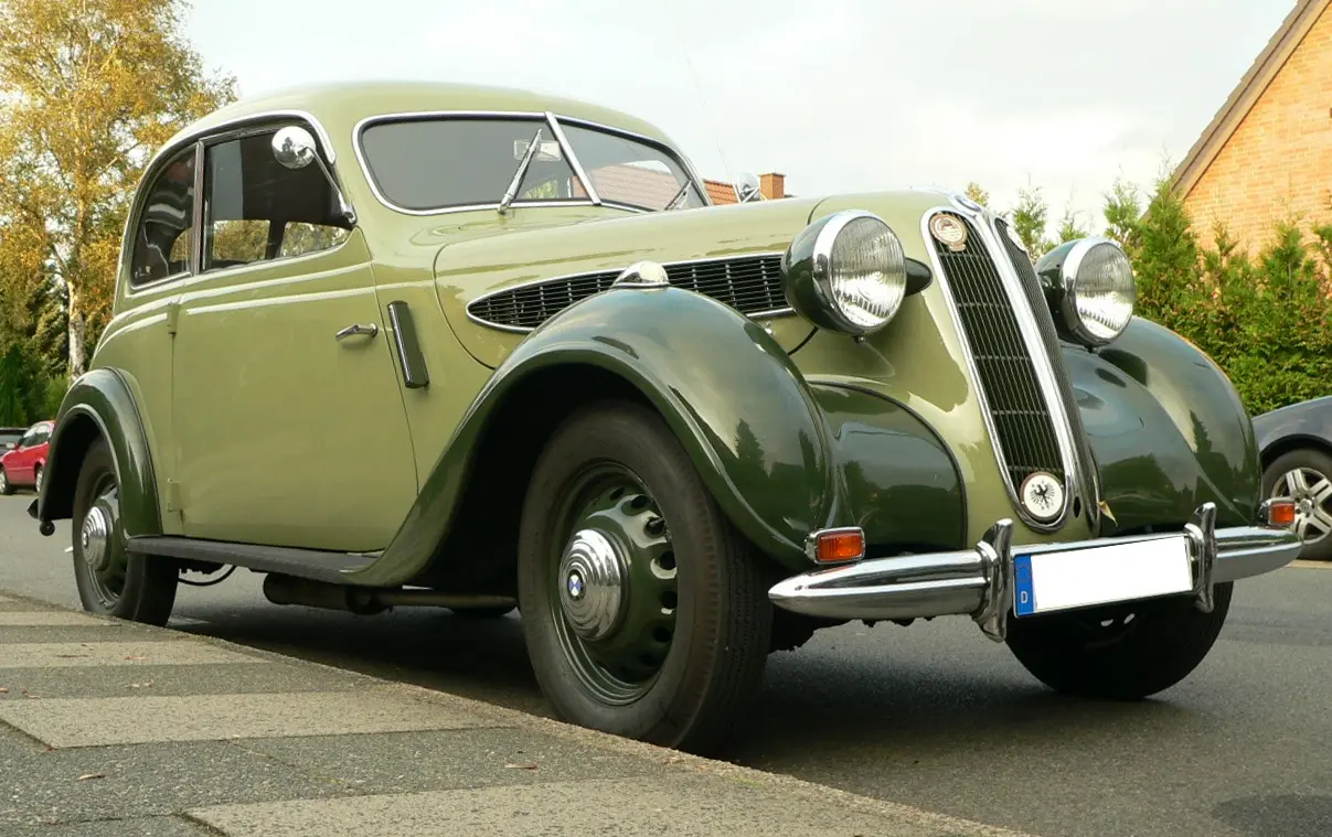 A pale green BMW 321 two-door saloon from the late 1930s