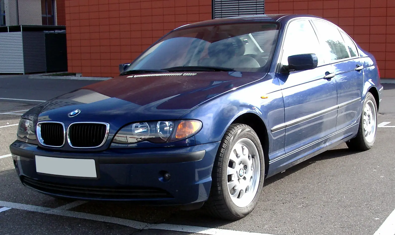 A dark blue BMW E46 3 Series saloon, facelift version, parked